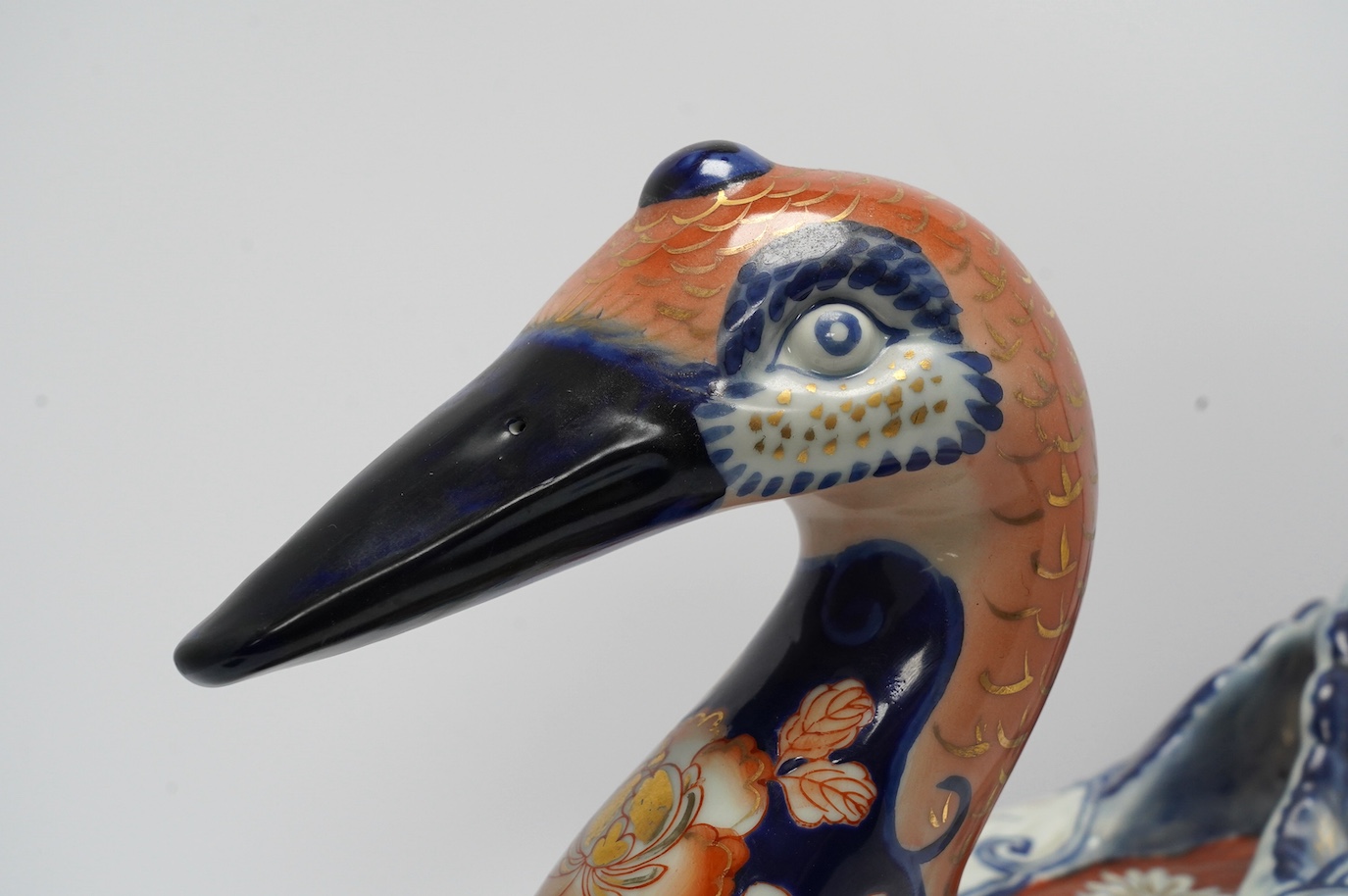 A large porcelain duck box, decorated in the Imari pattern, 40cm wide. Condition - fair